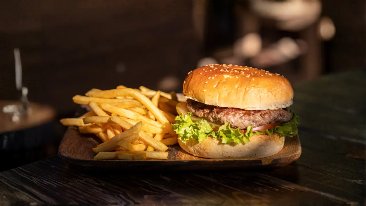 Delicious burgers, fries, and salad on table in Austin food truck photos